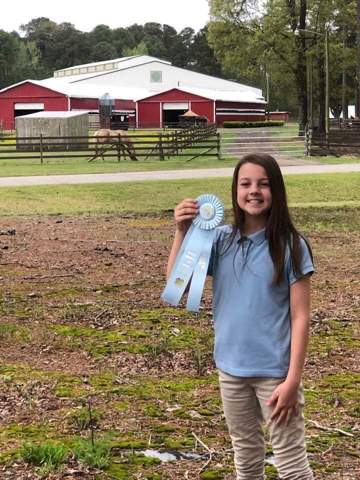 girl with blue ribbon