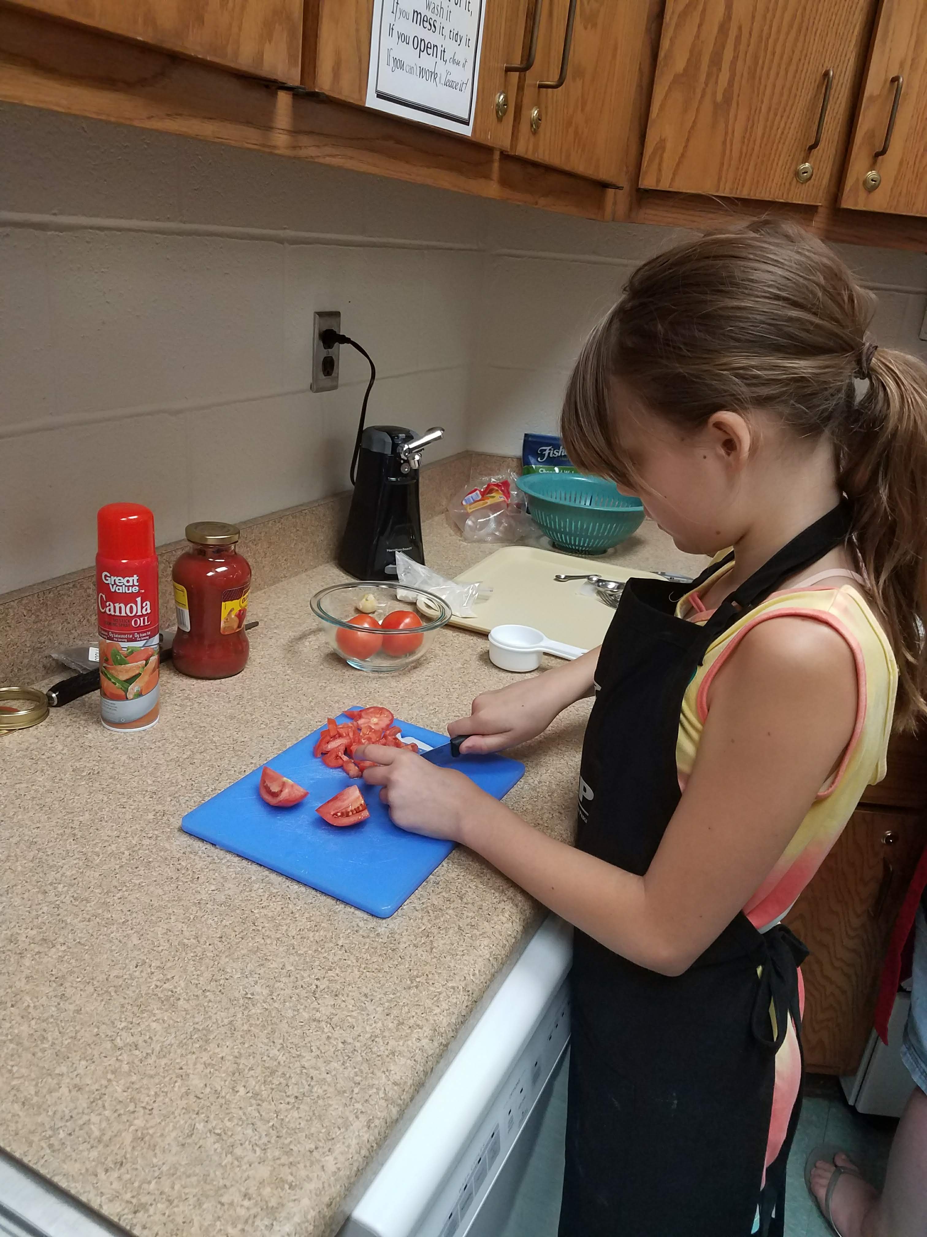 girl cutting vegetables