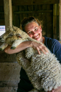 woman holding sheep