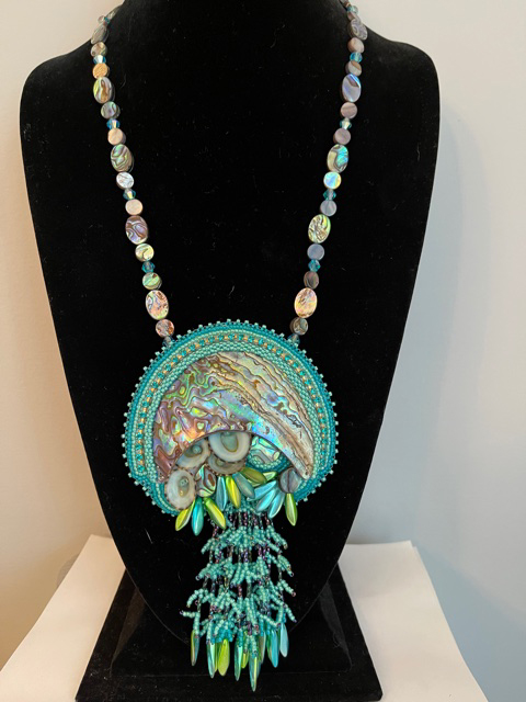 elaborate turquoise colored beaded necklace